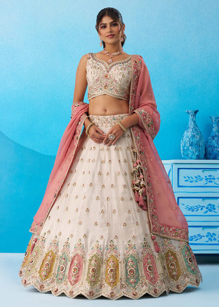 Buy Now Cream Multicolor Patch Work Lehenga Choli with Pink Dupatta Online in US, UK, Canada, France, Italy, Germany, Sweden, Denmark & Worldwide at Empress.