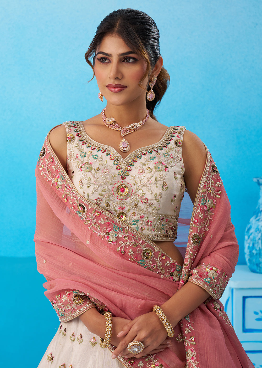 Buy Now Cream Multicolor Patch Work Lehenga Choli with Pink Dupatta Online in US, UK, Canada, France, Italy, Germany, Sweden, Denmark & Worldwide at Empress.