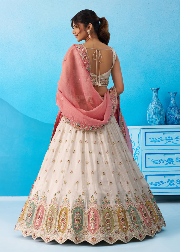 Buy Now Cream Multicolor Patch Work Lehenga Choli with Pink Dupatta Online in US, UK, Canada, France, Italy, Germany, Sweden, Denmark & Worldwide at Empress.