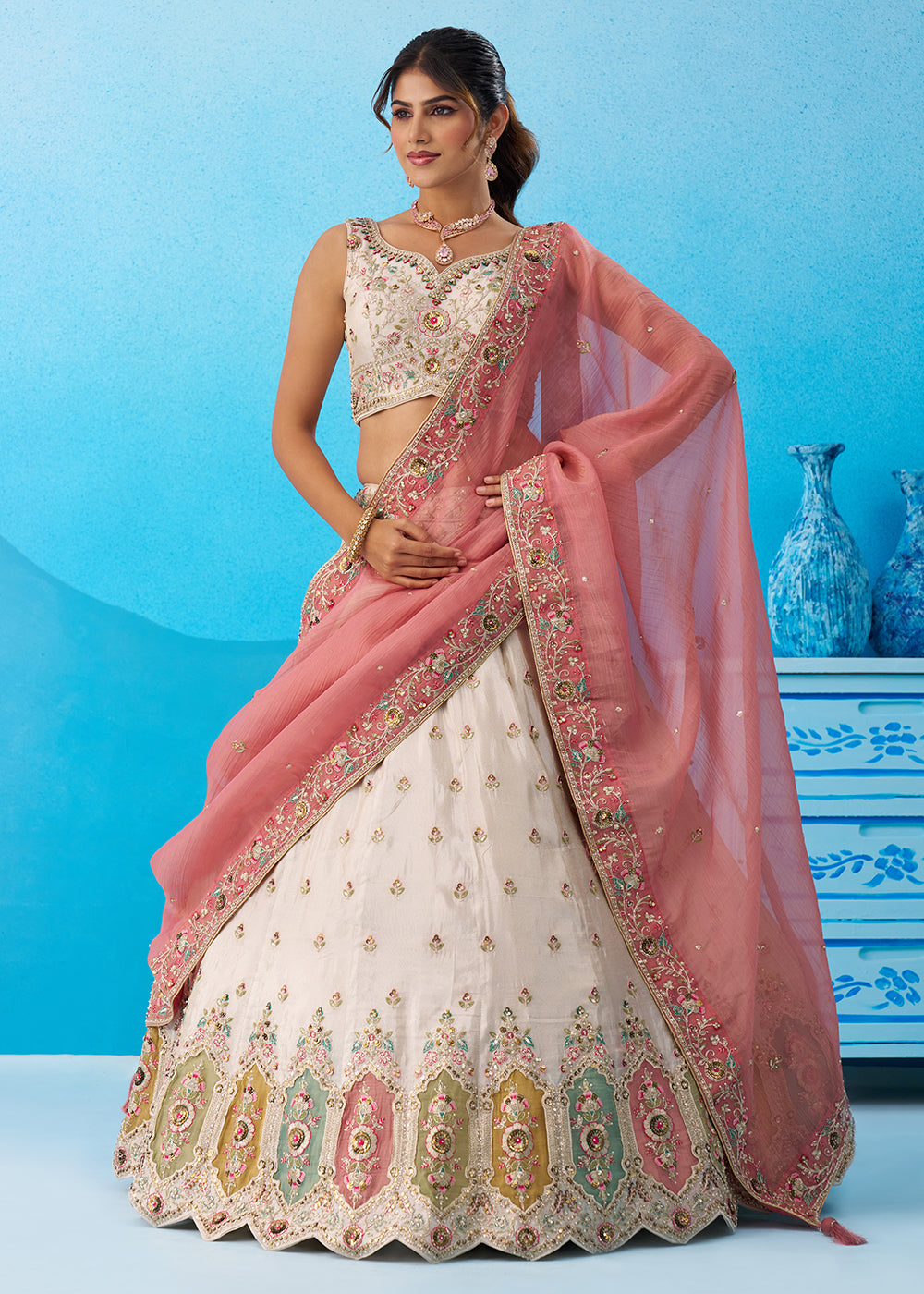 Buy Now Cream Multicolor Patch Work Lehenga Choli with Pink Dupatta Online in US, UK, Canada, France, Italy, Germany, Sweden, Denmark & Worldwide at Empress.