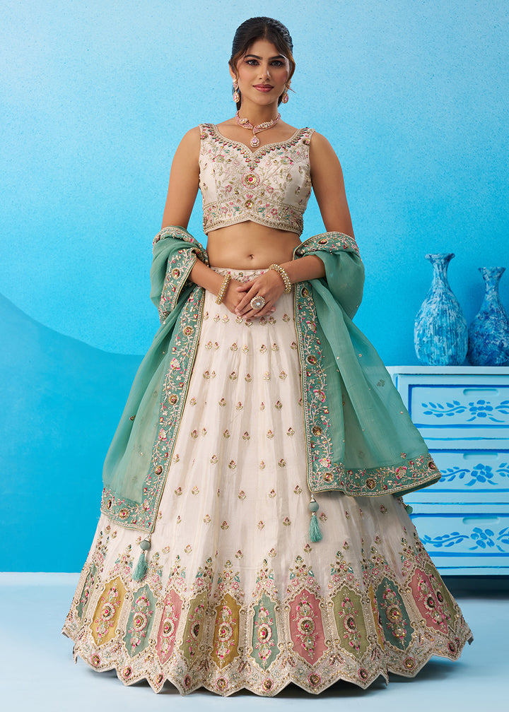 Buy Now Cream Multicolor Patch Work Lehenga Choli with Sky Dupatta Online in US, UK, Canada, France, Italy, Germany, Sweden, Denmark & Worldwide at Empress.