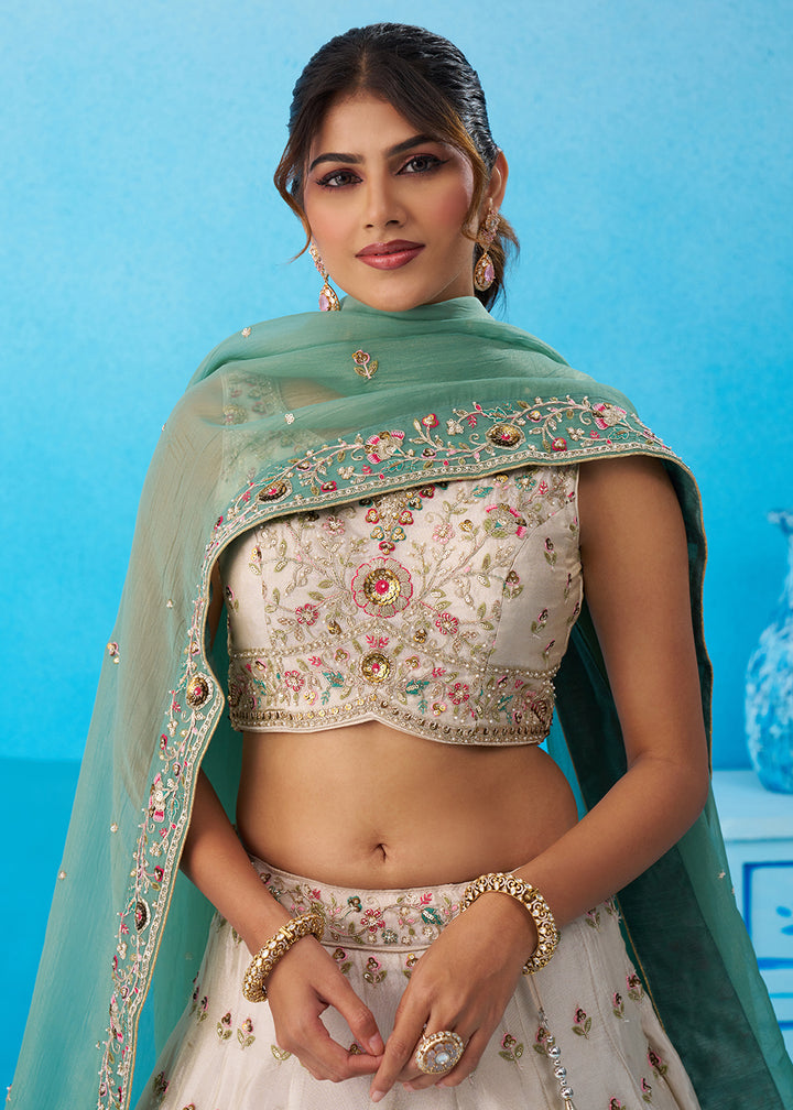 Buy Now Cream Multicolor Patch Work Lehenga Choli with Sky Dupatta Online in US, UK, Canada, France, Italy, Germany, Sweden, Denmark & Worldwide at Empress.