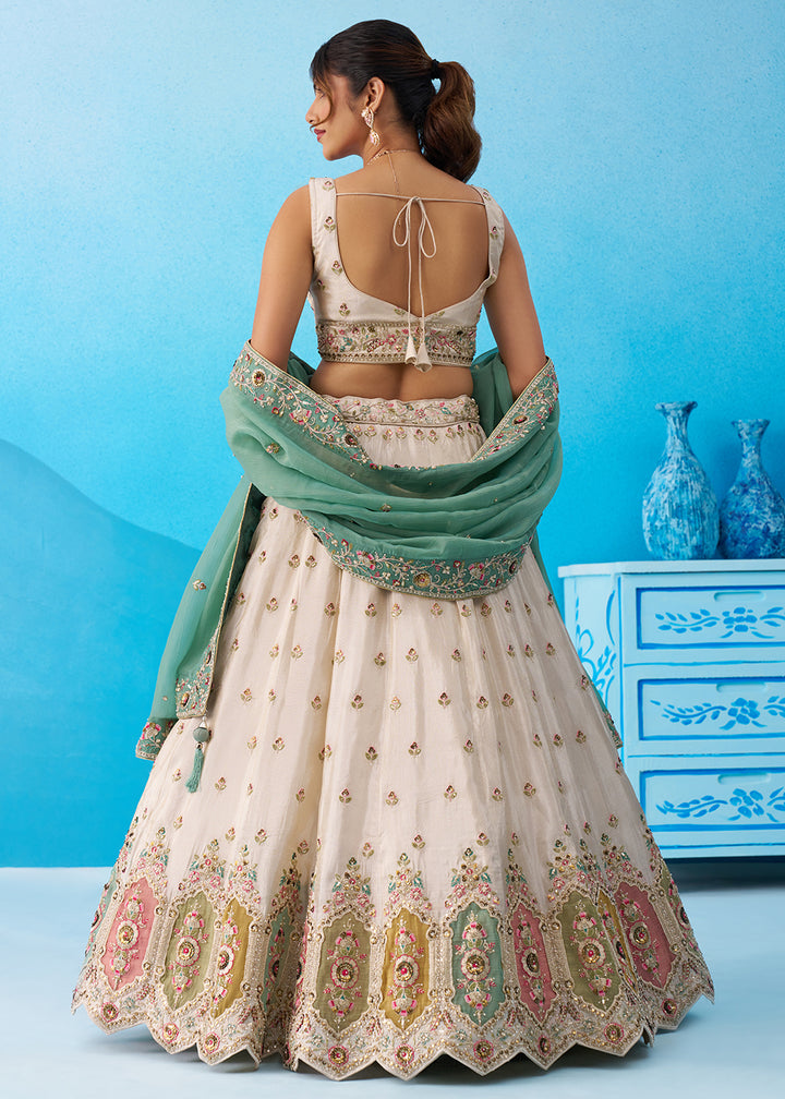 Buy Now Cream Multicolor Patch Work Lehenga Choli with Sky Dupatta Online in US, UK, Canada, France, Italy, Germany, Sweden, Denmark & Worldwide at Empress.