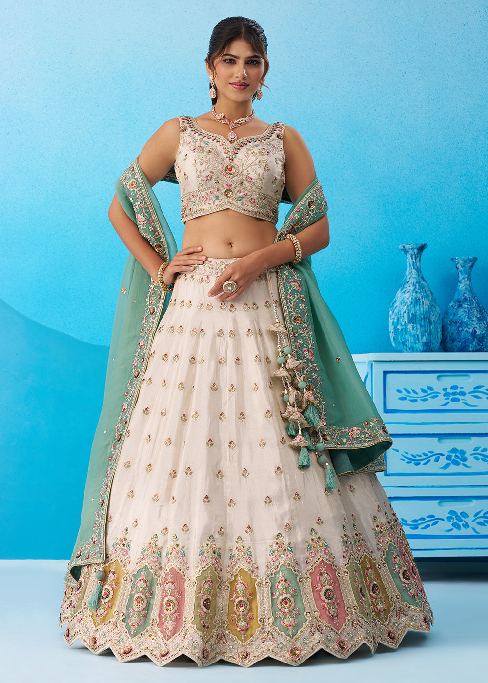 Buy Now Cream Multicolor Patch Work Lehenga Choli with Sky Dupatta Online in US, UK, Canada, France, Italy, Germany, Sweden, Denmark & Worldwide at Empress.