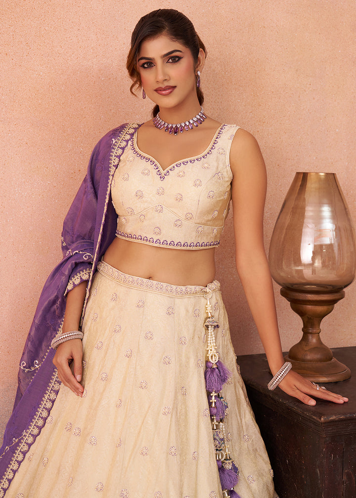 Buy Now Cream Jacquard with Peacock Patch Work Lehenga Choli Online in US, UK, Canada, France, Italy, Germany, Sweden, Denmark, UAE & Worldwide at Empress.