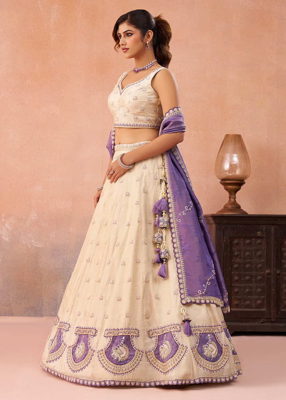 Buy Now Cream Jacquard with Peacock Patch Work Lehenga Choli Online in US, UK, Canada, France, Italy, Germany, Sweden, Denmark, UAE & Worldwide at Empress.
