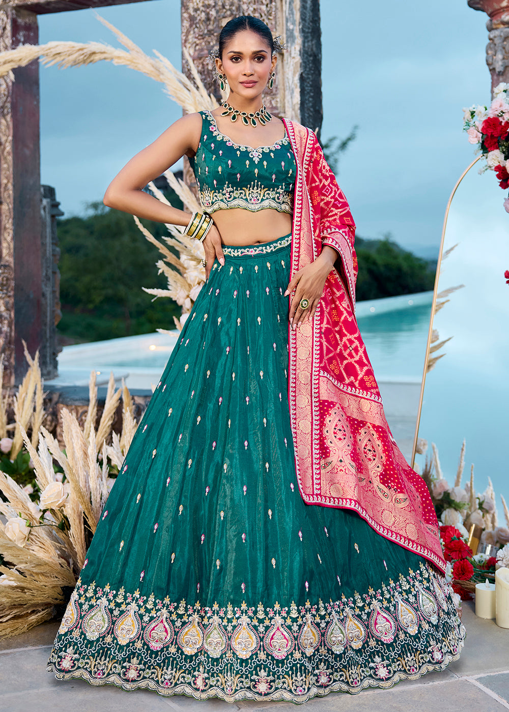 Buy Now Green Cosmos Silk Embroidered Wedding Lehenga Choli Online in US, UK, Canada, France, Italy, Germany, Sweden, Denmark, Greece & Worldwide at Empress.