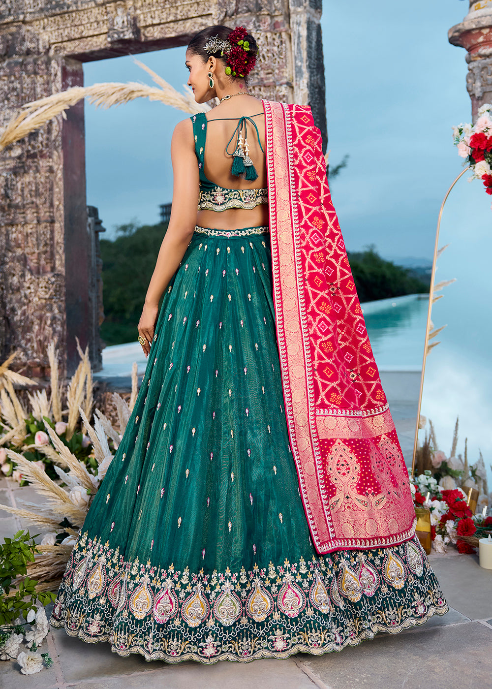 Buy Now Green Cosmos Silk Embroidered Wedding Lehenga Choli Online in US, UK, Canada, France, Italy, Germany, Sweden, Denmark, Greece & Worldwide at Empress.