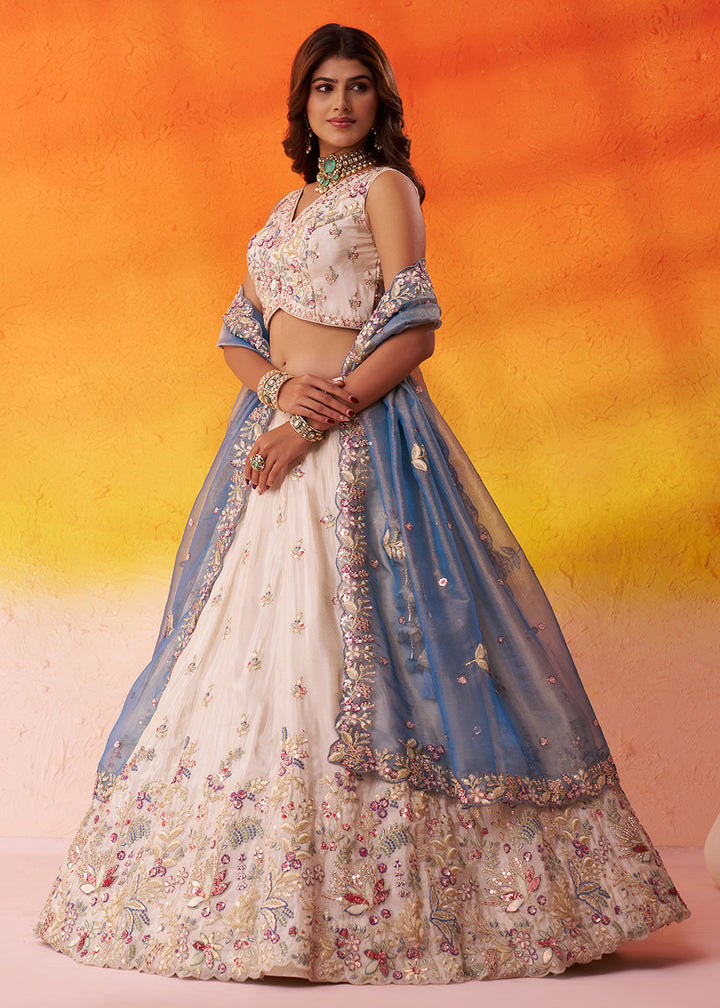 Buy Now Beige Moti Work Designer Lehenga Choli with Blue Dupatta Online in US, UK, Canada, France, Germany, Sweden, Greece, Denmark, UAE & Worldwide at Empress.