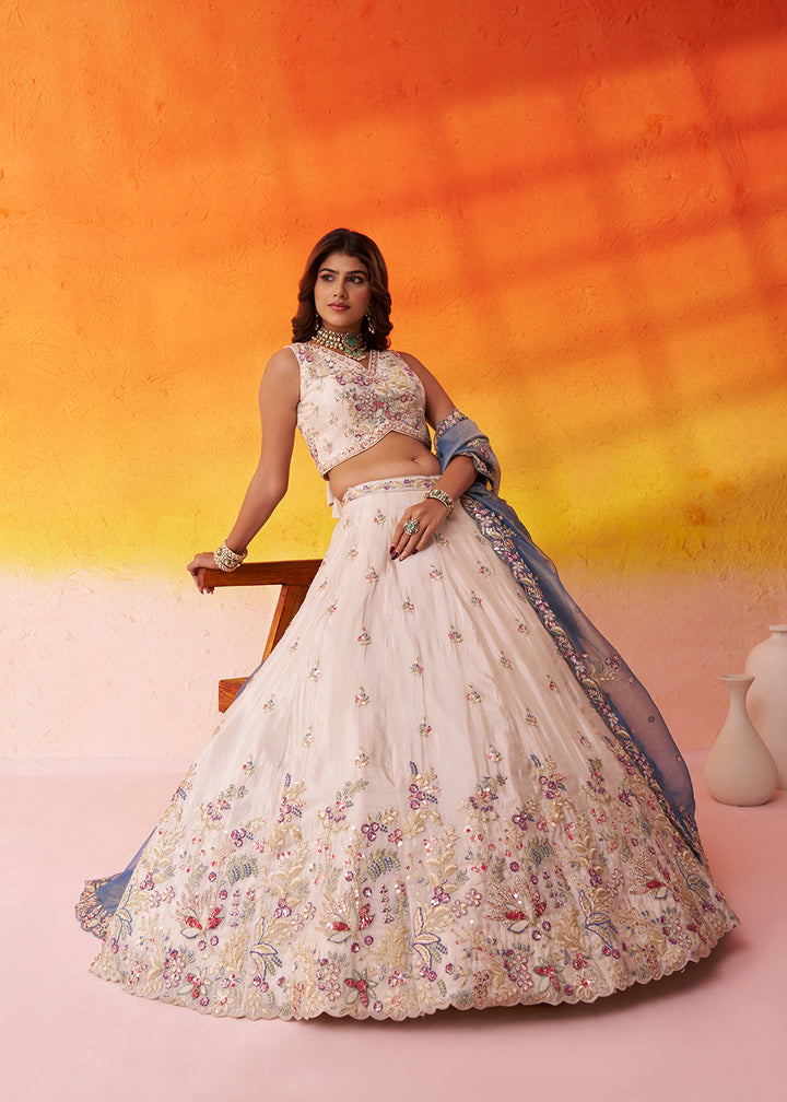 Buy Now Beige Moti Work Designer Lehenga Choli with Blue Dupatta Online in US, UK, Canada, France, Germany, Sweden, Greece, Denmark, UAE & Worldwide at Empress.