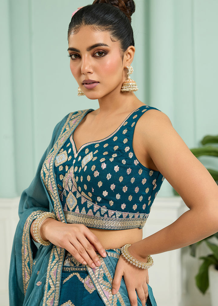 Buy Now Reception Style Teal Blue Embroidered Lehenga Choli Online in US, UK, Canada, France, Italy, Germany, Sweden, Denmark, Greece & Worldwide at Empress.