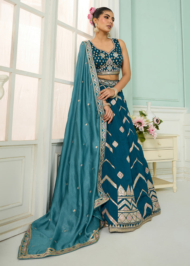 Buy Now Reception Style Teal Blue Embroidered Lehenga Choli Online in US, UK, Canada, France, Italy, Germany, Sweden, Denmark, Greece & Worldwide at Empress.