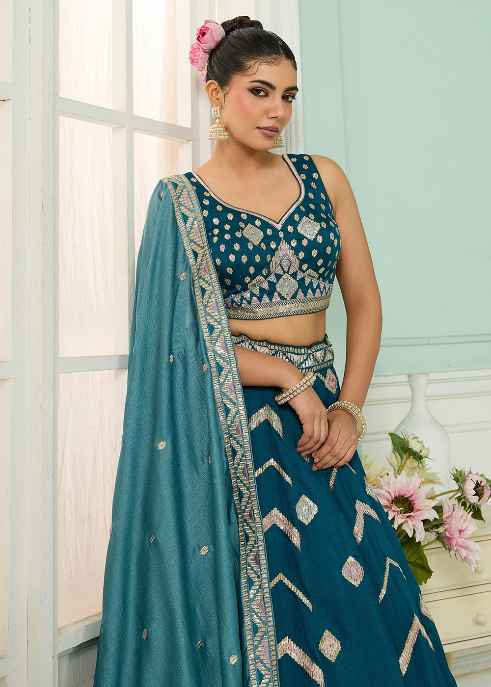Buy Now Reception Style Teal Blue Embroidered Lehenga Choli Online in US, UK, Canada, France, Italy, Germany, Sweden, Denmark, Greece & Worldwide at Empress.
