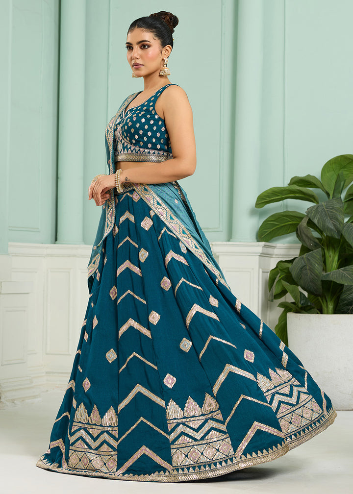 Buy Now Reception Style Teal Blue Embroidered Lehenga Choli Online in US, UK, Canada, France, Italy, Germany, Sweden, Denmark, Greece & Worldwide at Empress.