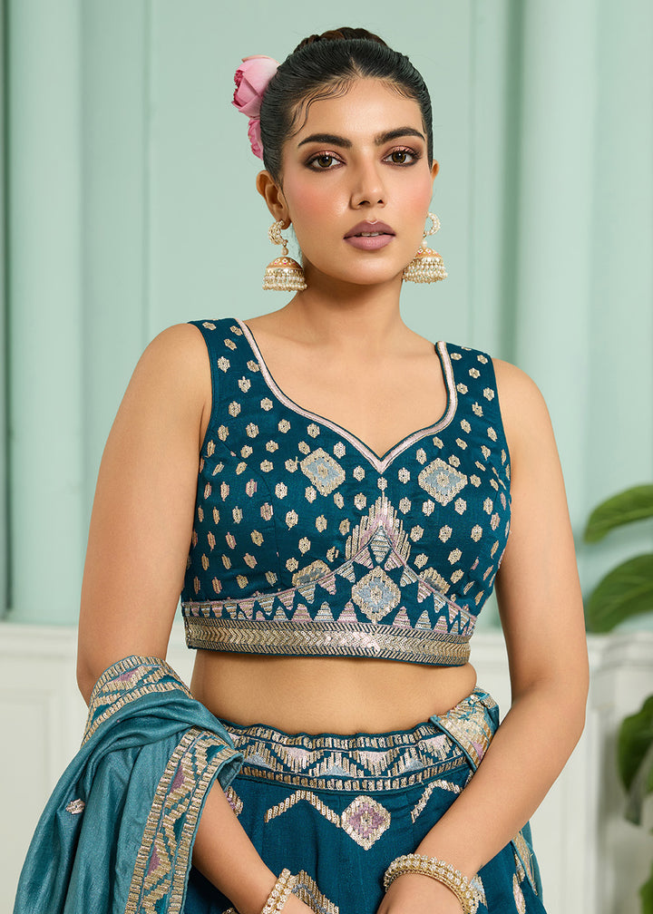 Buy Now Reception Style Teal Blue Embroidered Lehenga Choli Online in US, UK, Canada, France, Italy, Germany, Sweden, Denmark, Greece & Worldwide at Empress.
