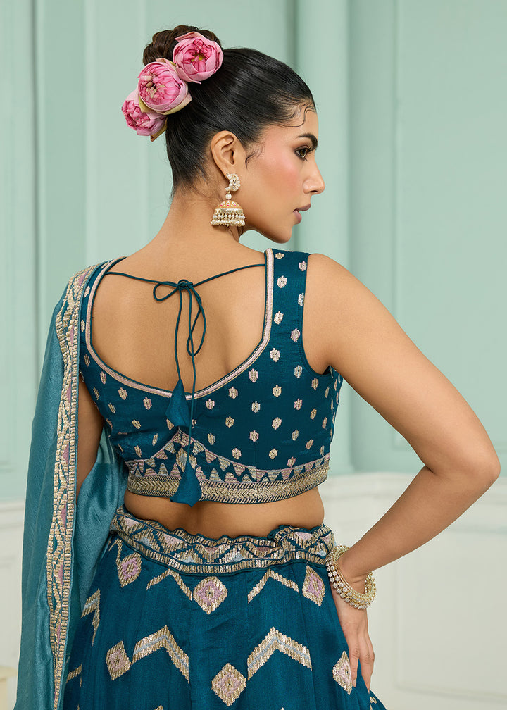 Buy Now Reception Style Teal Blue Embroidered Lehenga Choli Online in US, UK, Canada, France, Italy, Germany, Sweden, Denmark, Greece & Worldwide at Empress.