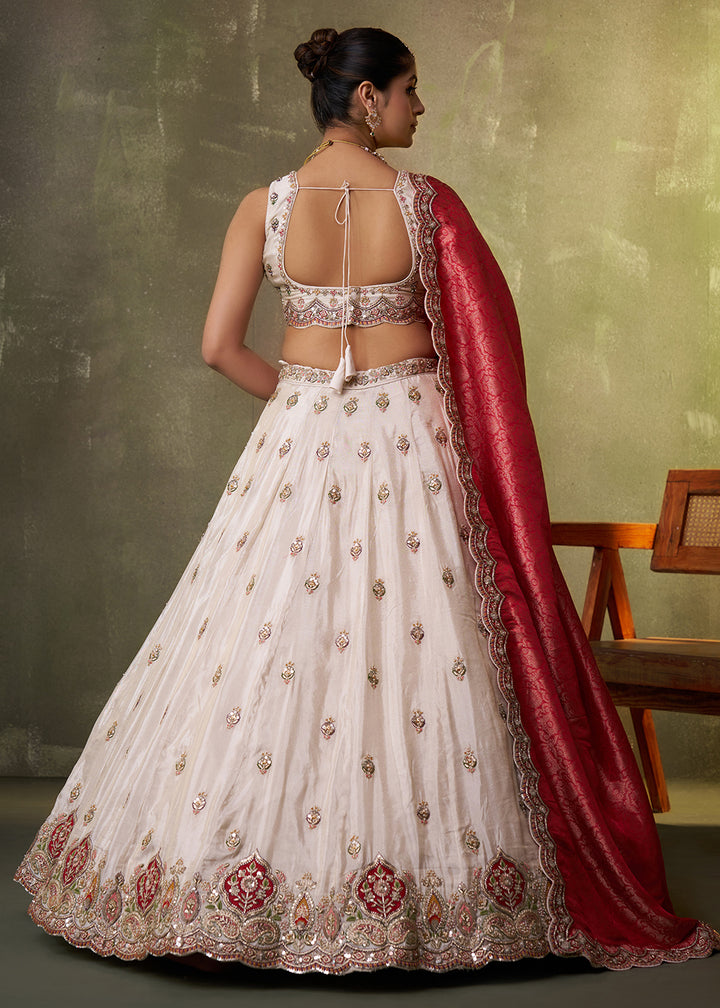 Buy Now Beige Designer Lehenga Choli with Red Banarasi Silk Dupatta Online in US, UK, Canada, France, Germany, Sweden, Greece, Denmark & Worldwide at Empress.