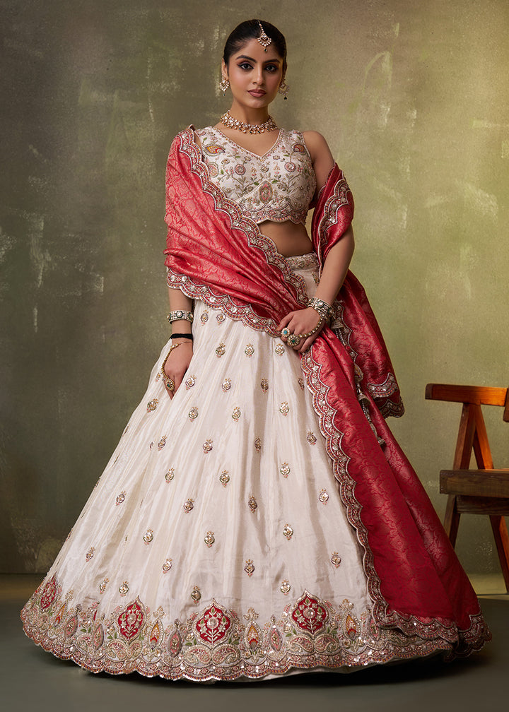 Buy Now Beige Designer Lehenga Choli with Red Banarasi Silk Dupatta Online in US, UK, Canada, France, Germany, Sweden, Greece, Denmark & Worldwide at Empress.