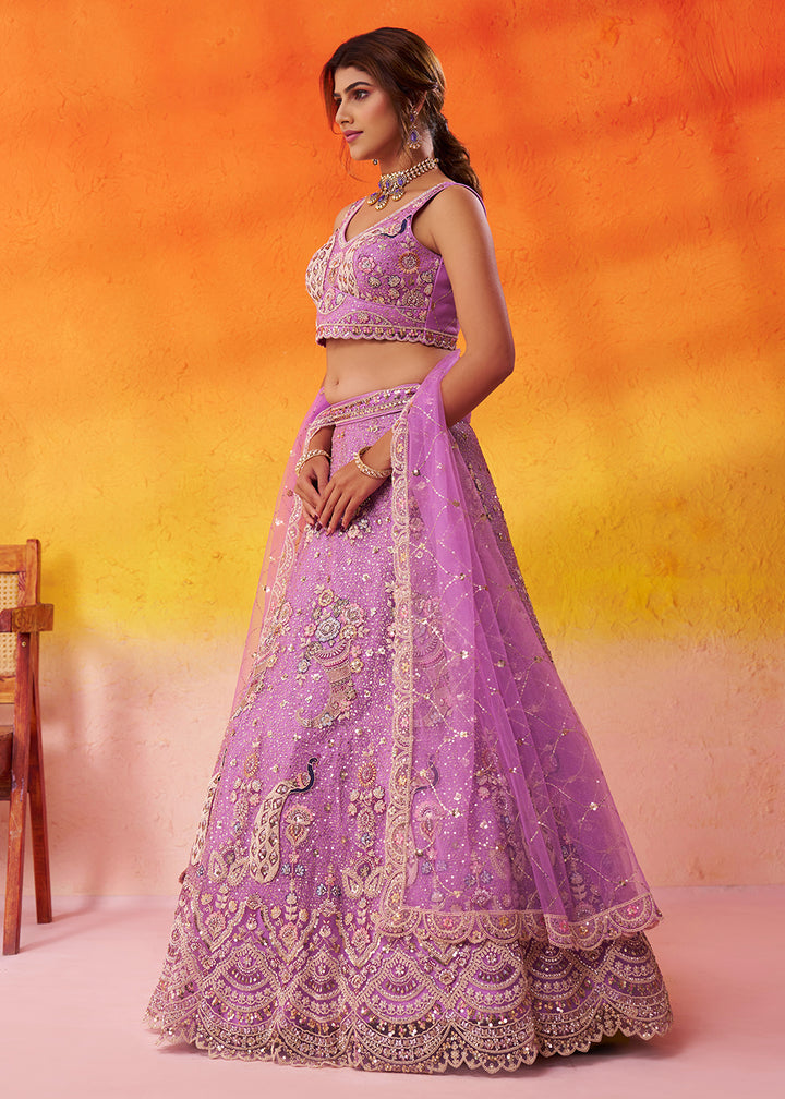 Buy Now Attractive Mauve Net Embroidered Wedding Lehenga Choli Online in US, UK, Canada, France, Germany, Sweden, Greece, UAE, Denmark & Worldwide at Empress.