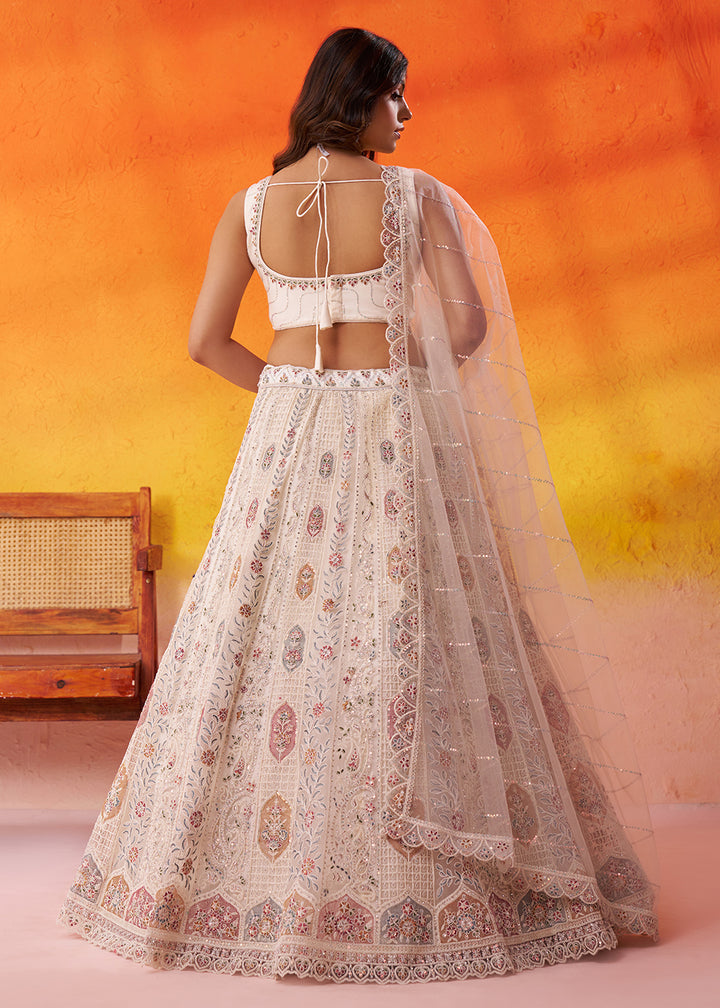 Buy Now Cream Flared Embroidered Festive Lehenga Choli Online in US, UK, Canada, France, Germany, Sweden, Greece, Denmark, UAE, Maldives & Worldwide at Empress.