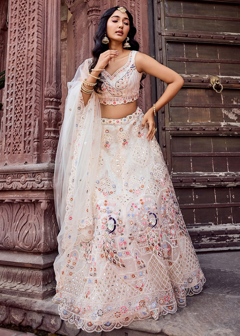 Buy Now Net Fabric Stone Work Cream Wedding Lehenga Choli Online in US, UK, Canada, France, Germany, Sweden, Greece, Denmark, UAE & Worldwide at Empress.
