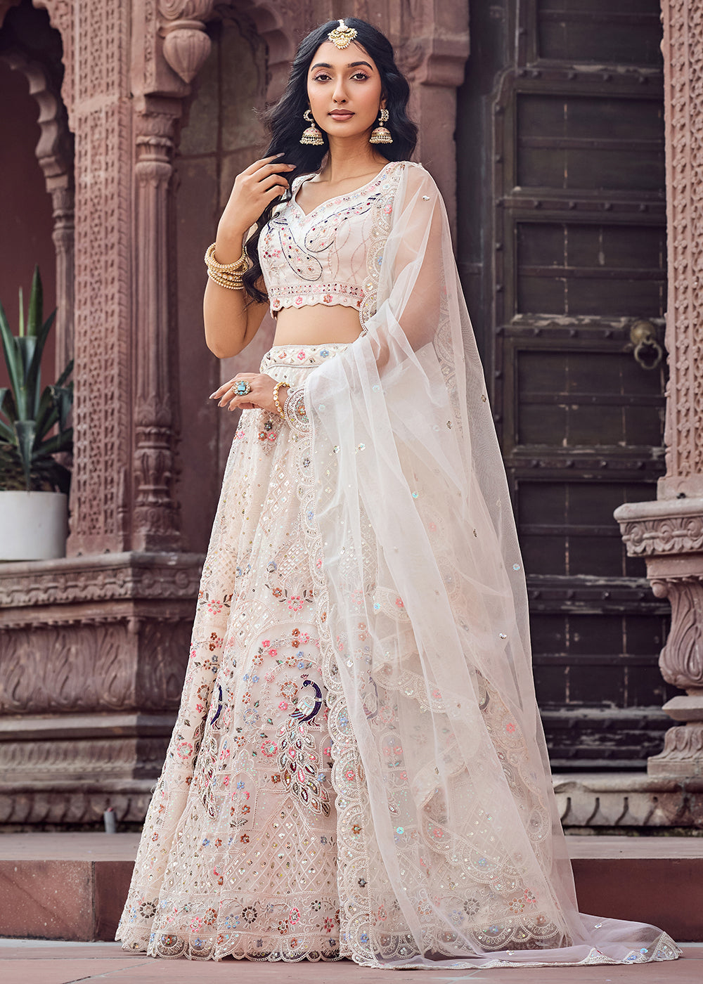 Buy Now Net Fabric Stone Work Cream Wedding Lehenga Choli Online in US, UK, Canada, France, Germany, Sweden, Greece, Denmark, UAE & Worldwide at Empress.