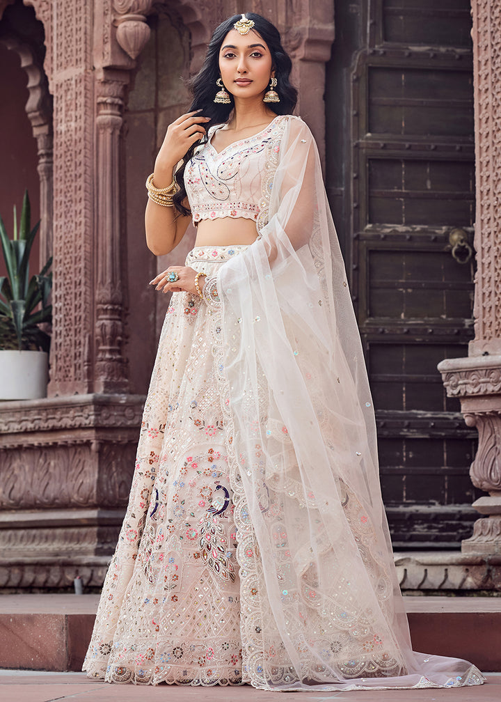 Buy Now Net Fabric Stone Work Cream Wedding Lehenga Choli Online in US, UK, Canada, France, Germany, Sweden, Greece, Denmark, UAE & Worldwide at Empress.