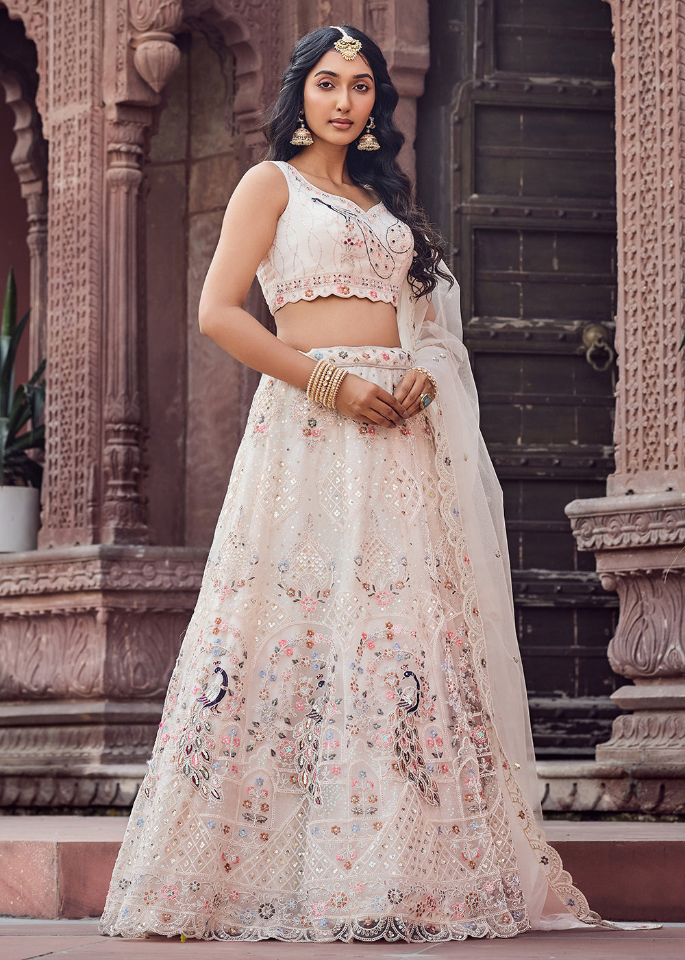 Buy Now Net Fabric Stone Work Cream Wedding Lehenga Choli Online in US, UK, Canada, France, Germany, Sweden, Greece, Denmark, UAE & Worldwide at Empress.