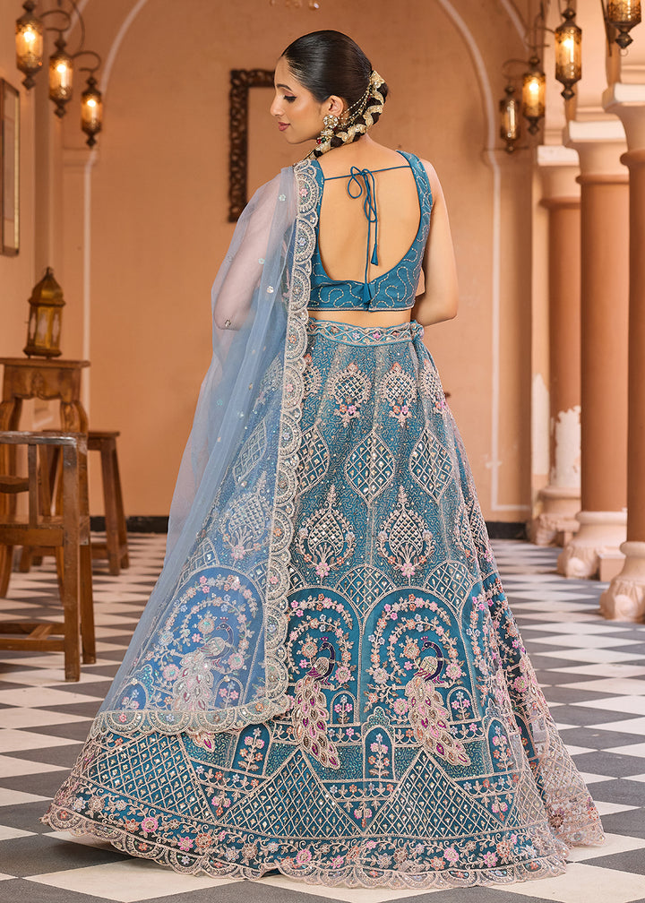 Buy Now Net Fabric Stone Work Teal Wedding Lehenga Choli Online in US, UK, Canada, France, Germany, Sweden, Greece, Denmark, UAE & Worldwide at Empress.