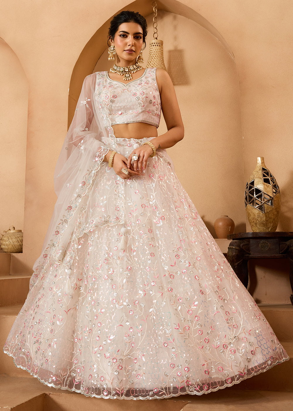 Buy Now Cream Sequins Embroidered Net Designer Party Lehenga Choli Online in US, UK, Canada, France, Italy, Germany, Sweden, Denmark & Worldwide at Empress.