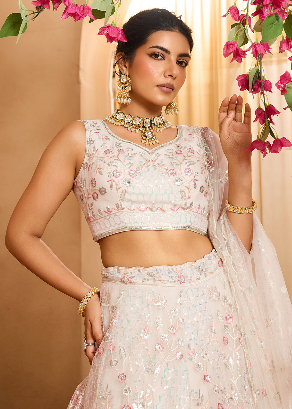 Buy Now Cream Sequins Embroidered Net Designer Party Lehenga Choli Online in US, UK, Canada, France, Italy, Germany, Sweden, Denmark & Worldwide at Empress.