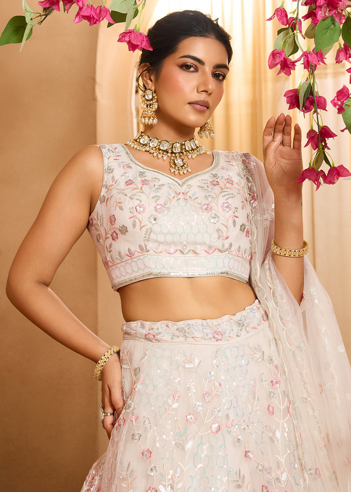 Buy Now Cream Sequins Embroidered Net Designer Party Lehenga Choli Online in US, UK, Canada, France, Italy, Germany, Sweden, Denmark & Worldwide at Empress.