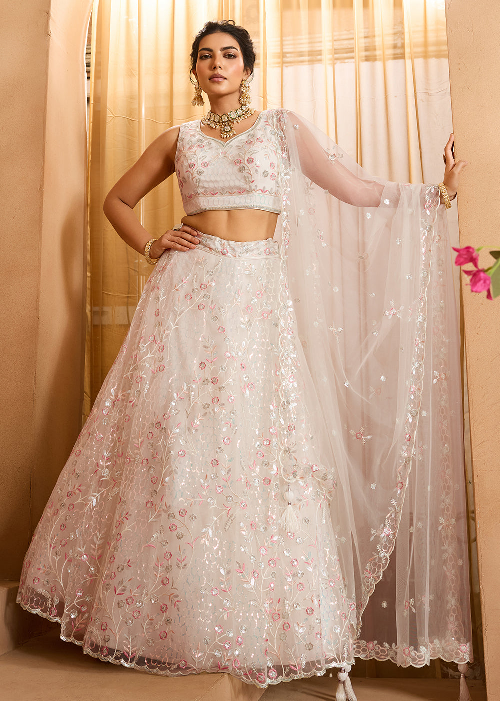 Buy Now Cream Sequins Embroidered Net Designer Party Lehenga Choli Online in US, UK, Canada, France, Italy, Germany, Sweden, Denmark & Worldwide at Empress.