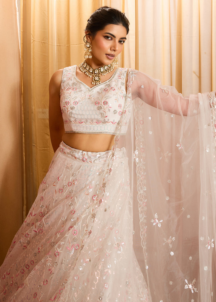 Buy Now Cream Sequins Embroidered Net Designer Party Lehenga Choli Online in US, UK, Canada, France, Italy, Germany, Sweden, Denmark & Worldwide at Empress.