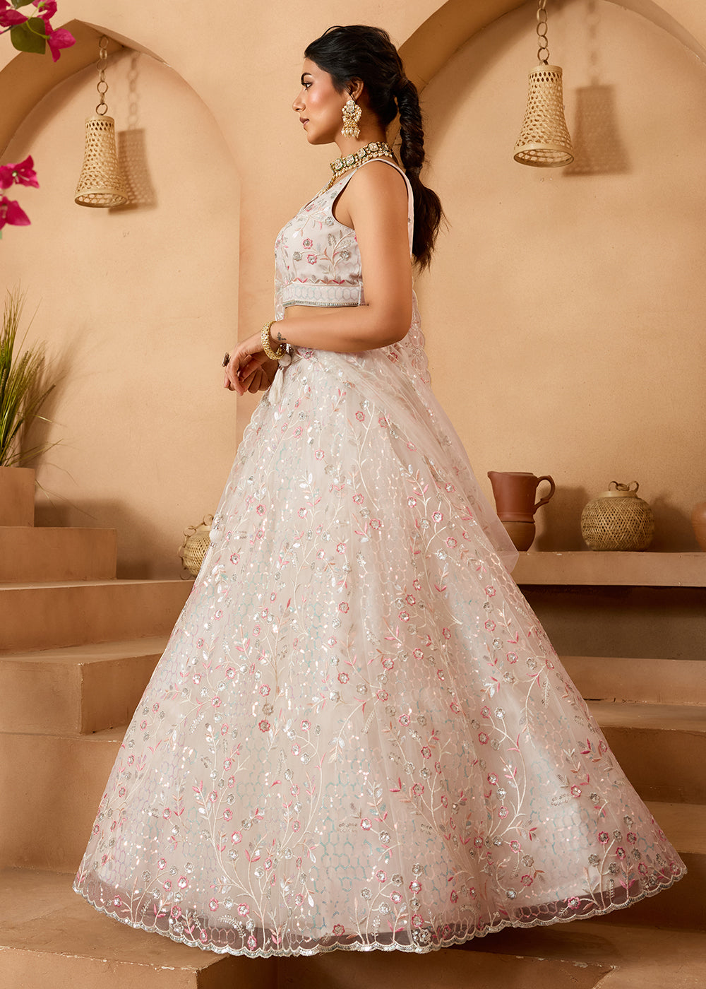 Buy Now Cream Sequins Embroidered Net Designer Party Lehenga Choli Online in US, UK, Canada, France, Italy, Germany, Sweden, Denmark & Worldwide at Empress.