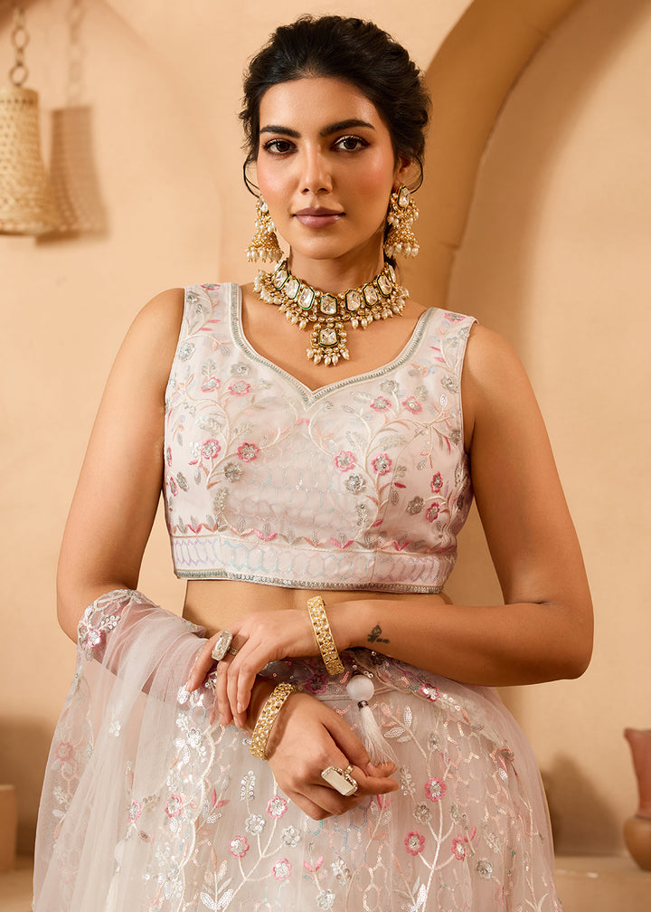 Buy Now Cream Sequins Embroidered Net Designer Party Lehenga Choli Online in US, UK, Canada, France, Italy, Germany, Sweden, Denmark & Worldwide at Empress.