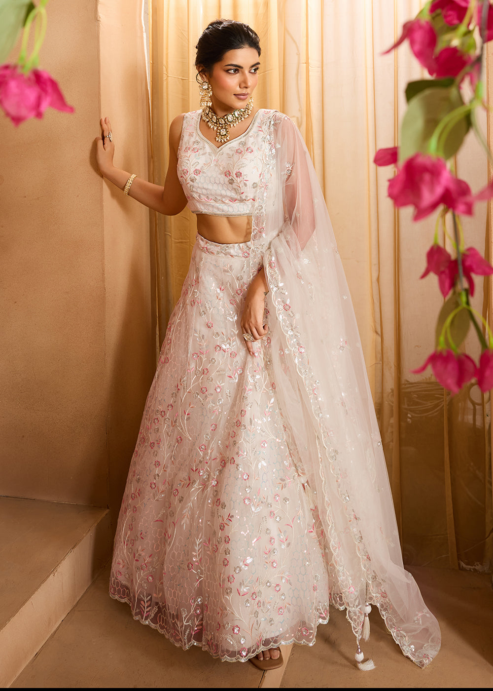 Buy Now Cream Sequins Embroidered Net Designer Party Lehenga Choli Online in US, UK, Canada, France, Italy, Germany, Sweden, Denmark & Worldwide at Empress.