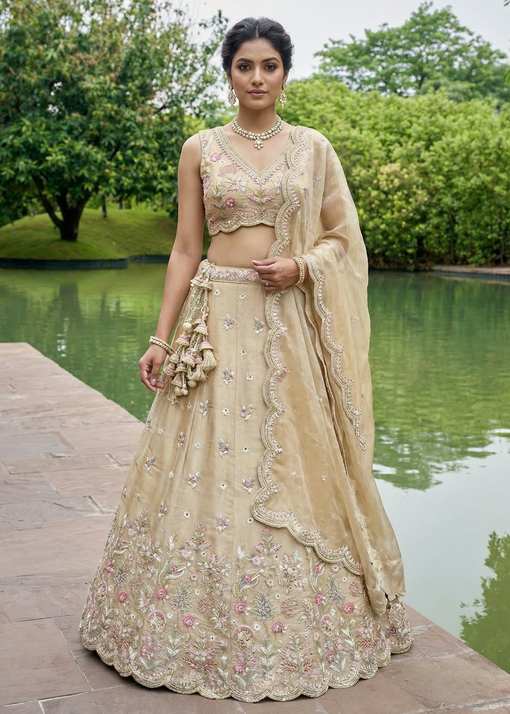 Buy Now Beige Tissue Mirror Sequince Embroidered Lehenga Choli Online in US, UK, Canada, France, Italy, Germany, Sweden, Denmark, Austria &amp; Worldwide at Empress.