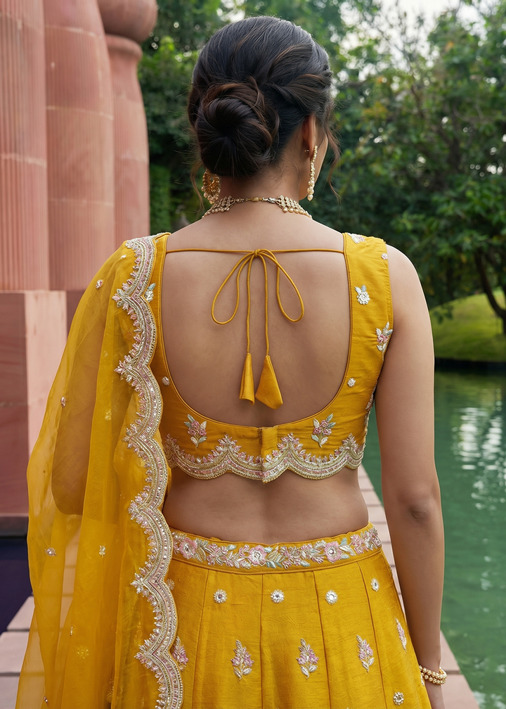 Buy Mustard Tissue Mirror Sequince Embroidered Lehenga Choli Online in US, UK, Canada, France, Italy, Germany, Sweden, Denmark, Austria &amp; Worldwide at Empress