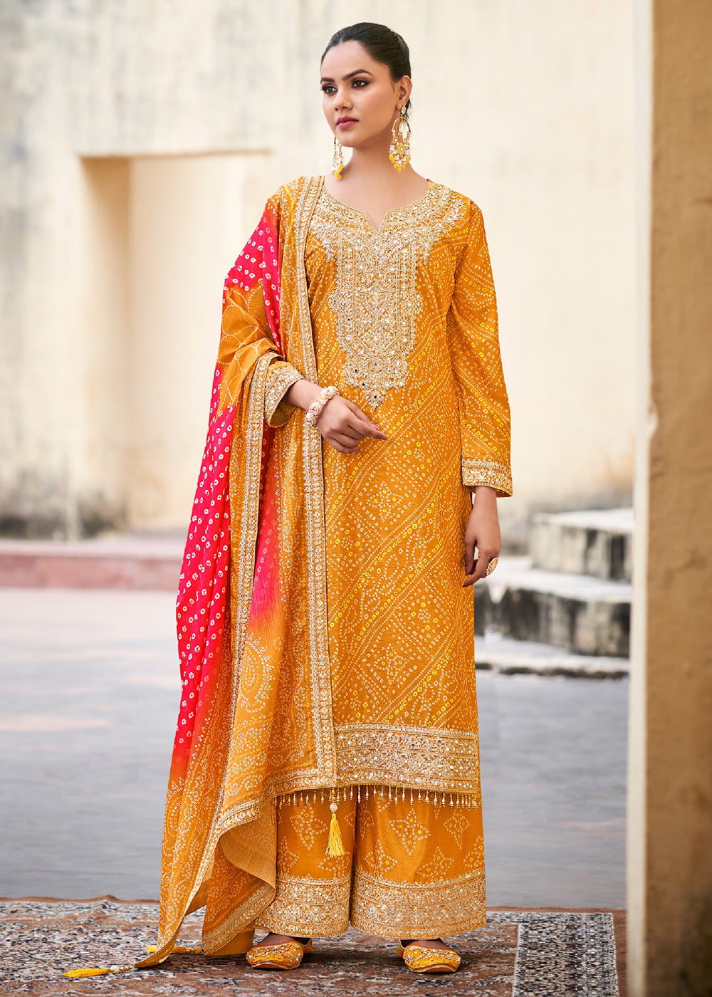 Buy Now Yellow Chinnon Mirror Embroidered Palazzo Style Suit Online in USA, UK, Canada, Germany & Worldwide at Empress Clothing.