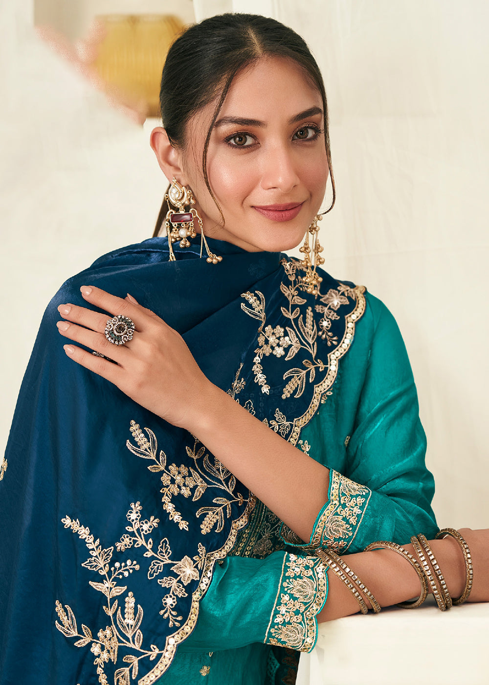 Buy Now Teal Fendy Silk Zarkan Work Festive Palazzo Suit Online in New York, Los Angeles, San Jose, Chicago, Houston, Fremont, Dubai & Worldwide at Empress.