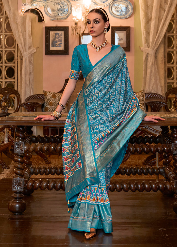 Shop Now Lovely Firozi Blue Woven Zari & Printed Patola Silk Traditional Saree from Empress Clothing in USA, UK, Canada & Worldwide. 