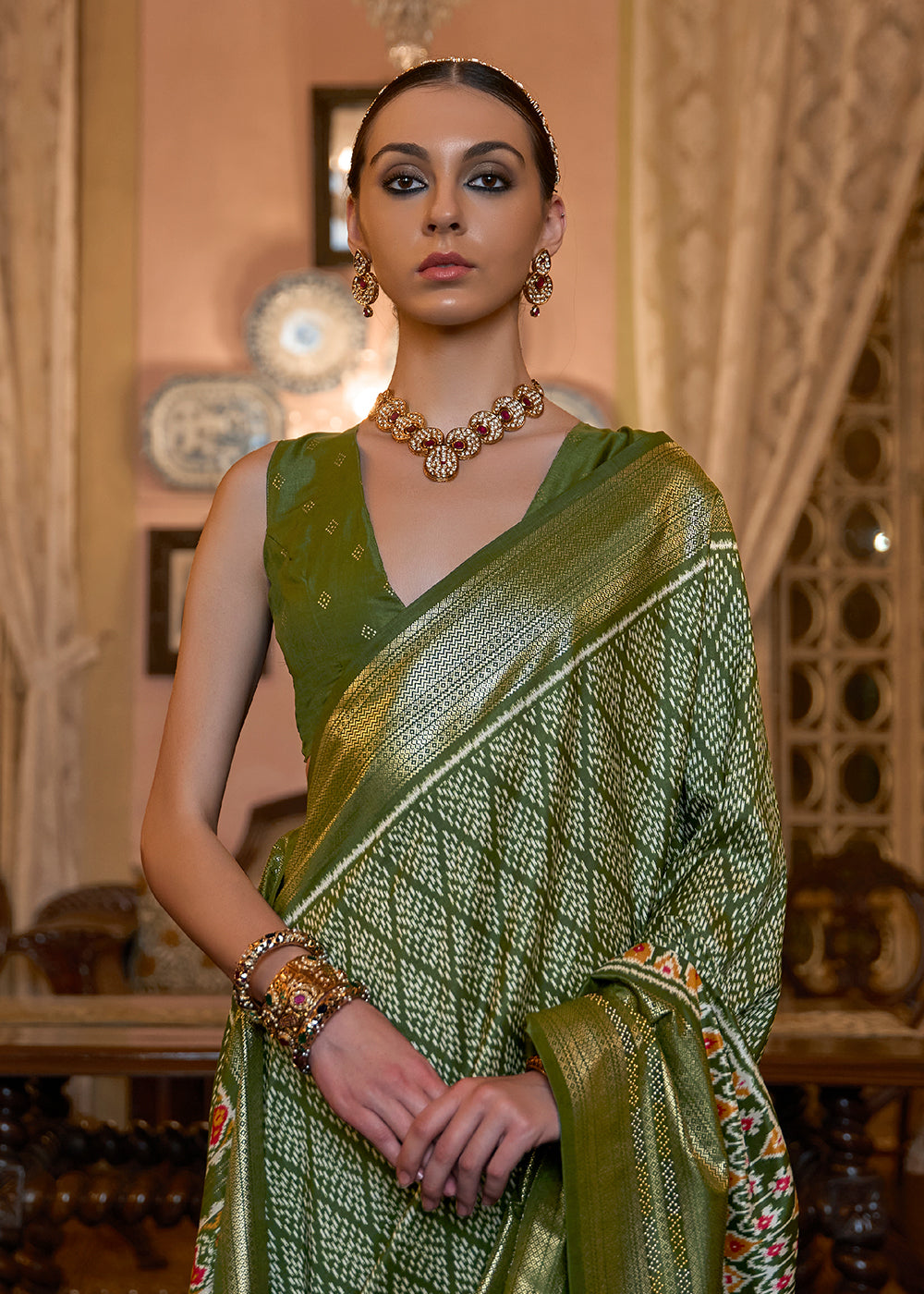 Shop Now Olive Green Woven Zari & Printed Patola Silk Traditional Saree from Empress Clothing in USA, UK, Canada & Worldwide. 