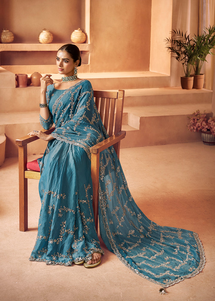 Buy Livid Blue Tissue Silk Heavy Embroidered Designer Saree Online in USA, UK, Canada, France, Germany, Italy, Denmark, UAE, Singapore & Worldwide at Empress.