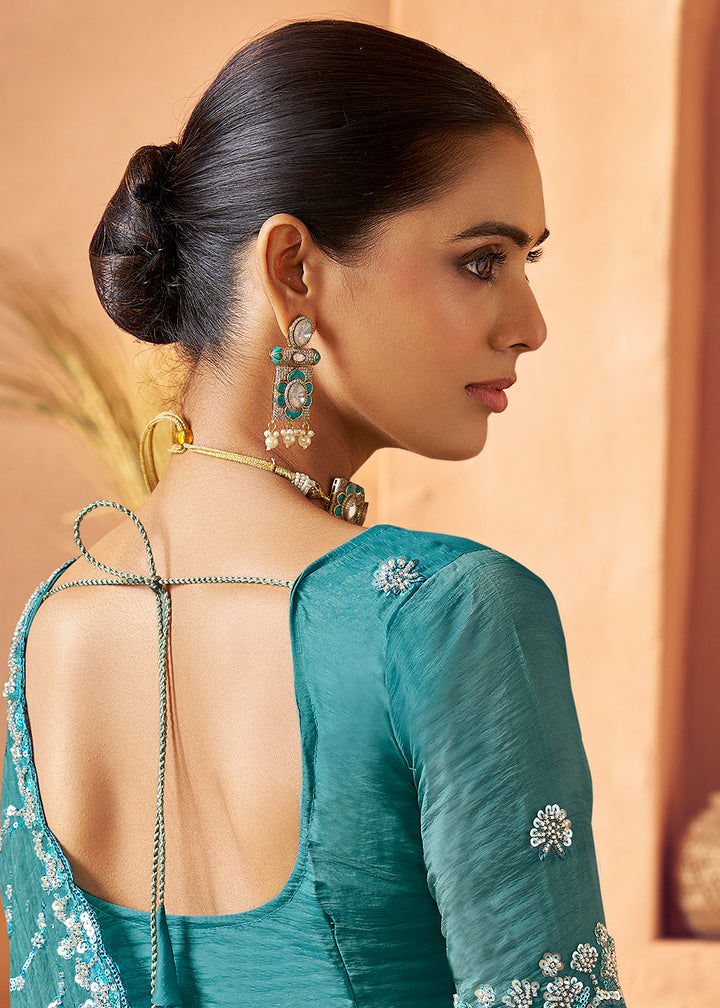 Buy Teal Blue Tissue Silk Heavy Embroidered Designer Saree Online in USA, UK, Canada, France, Germany, Italy, Denmark, UAE, Singapore & Worldwide at Empress.