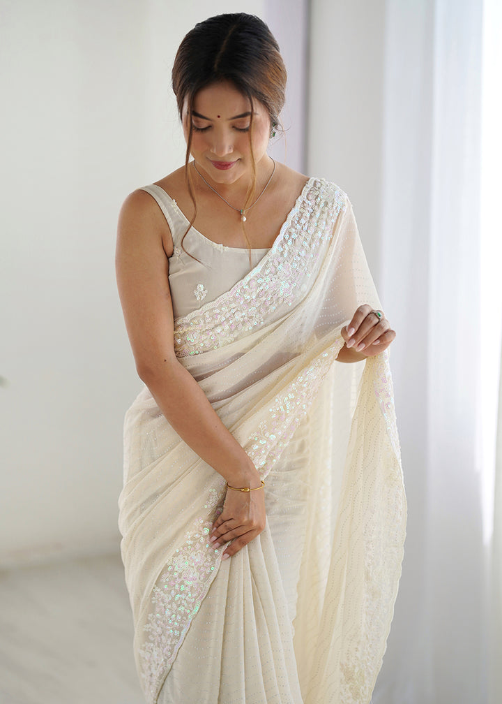 Buy Cream Georgette Designer Sequins Work Party Wear Saree Online in USA, UK, Canada, Spain, France, Germany, Italy, Austria, UAE, Qatar & Worldwide at Empress.