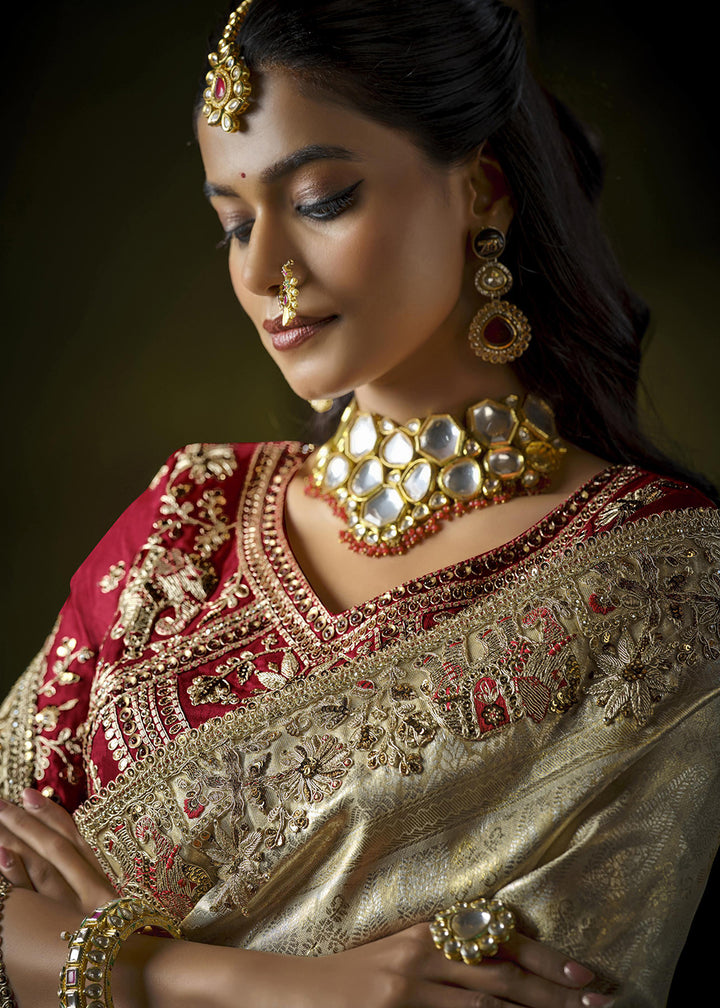 Buy Cream & Pink Heavy Silk Embroidered Bridal Wear Saree Online in USA, UK, Canada, France, Germany, Italy, Austria, Denmark, Singapore & Worldwide at Empress.