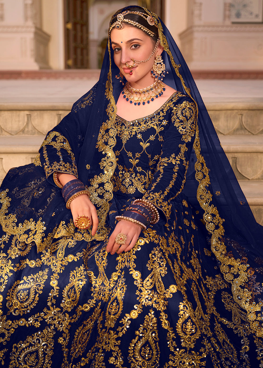 Buy Now Blue Velvet Heavy Embroidered A Line Lehenga Choli Online in USA, UK, Canada, France & Worldwide at Empress Clothing.