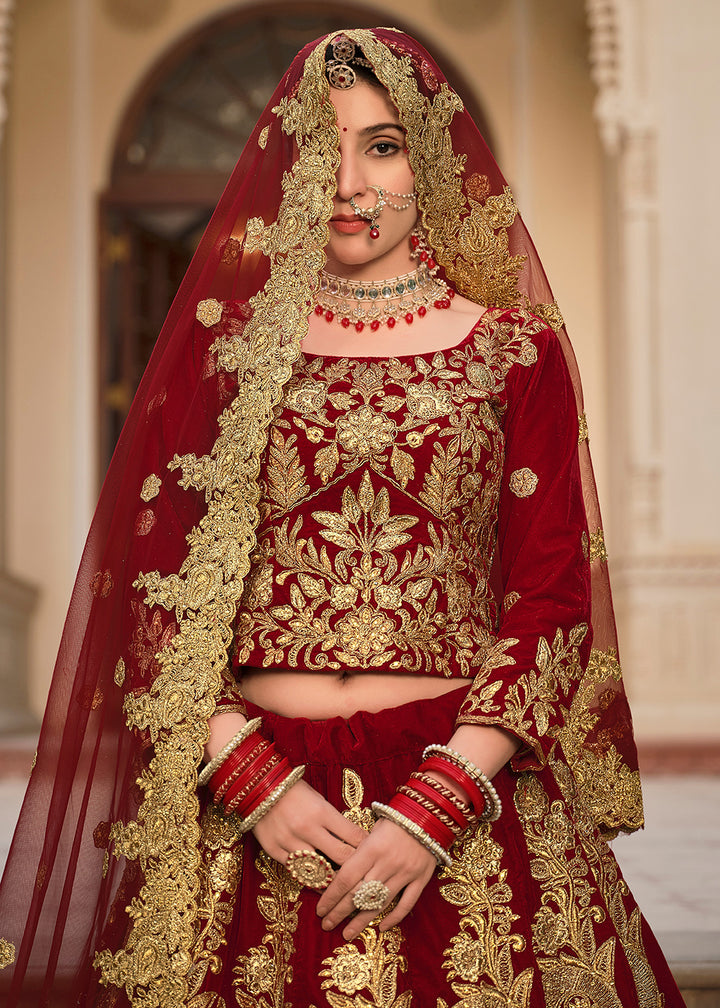 Buy Now Maroon & Gold Embroidered Velvet Wedding Lehenga Choli Online in USA, UK, France, UAE & Worldwide at Empress Clothing.