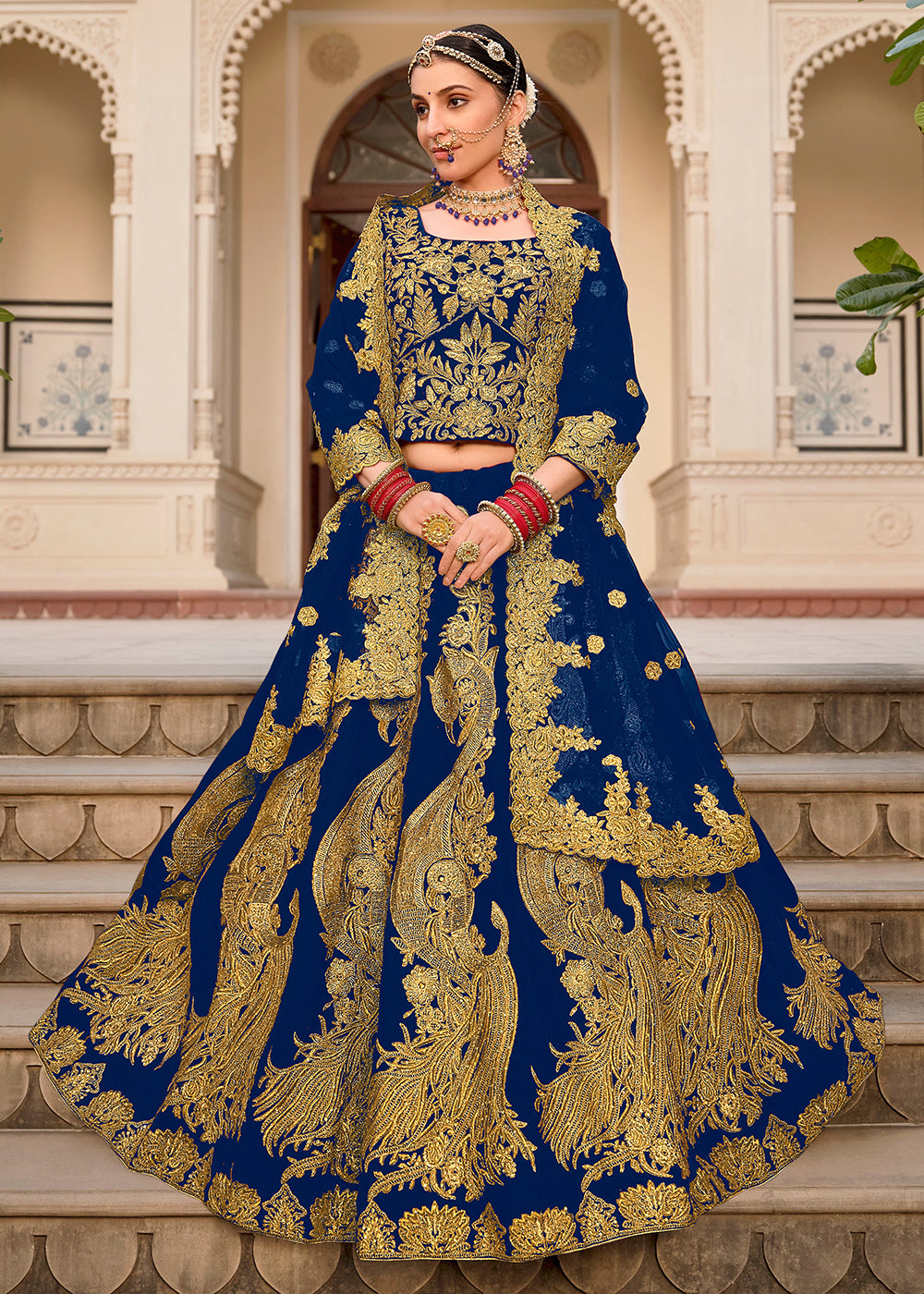 Buy Now Blue & Gold Embroidered Velvet Wedding Lehenga Choli Online in USA, UK, France, UAE & Worldwide at Empress Clothing